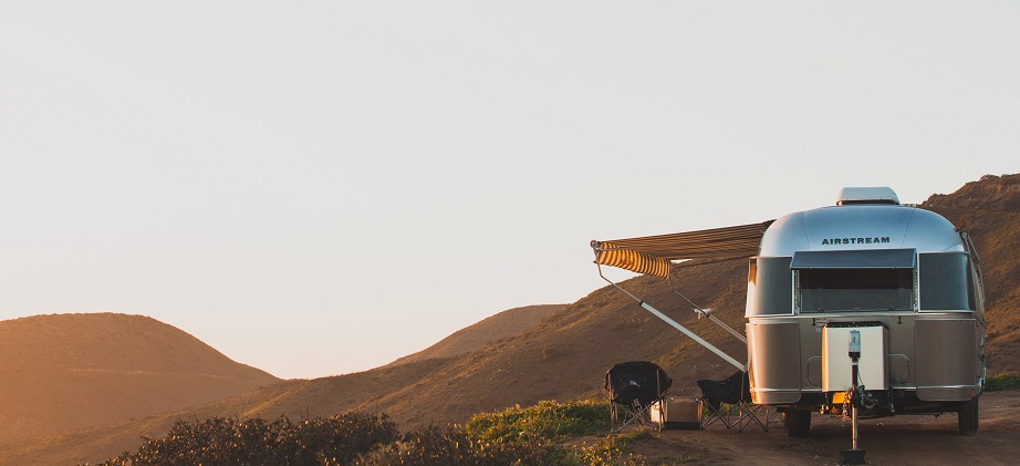 view of a motorhome and a sunset