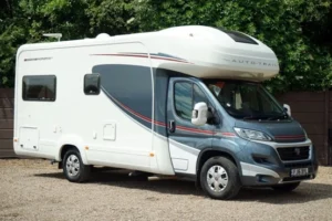 white and grey, Autotrail motorhome with garage, parked on gravel