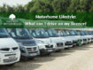 motorhomes parked in line on gravel field